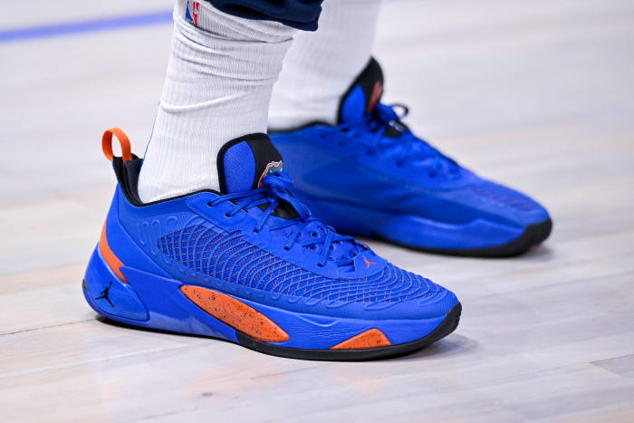 View of blue and orange Jordan Luka shoes.